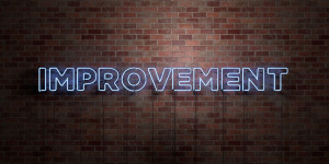 IMPROVEMENT - fluorescent Neon tube Sign on brickwork - Front view - 3D rendered royalty free stock picture. Can be used for online banner ads and direct mailers.